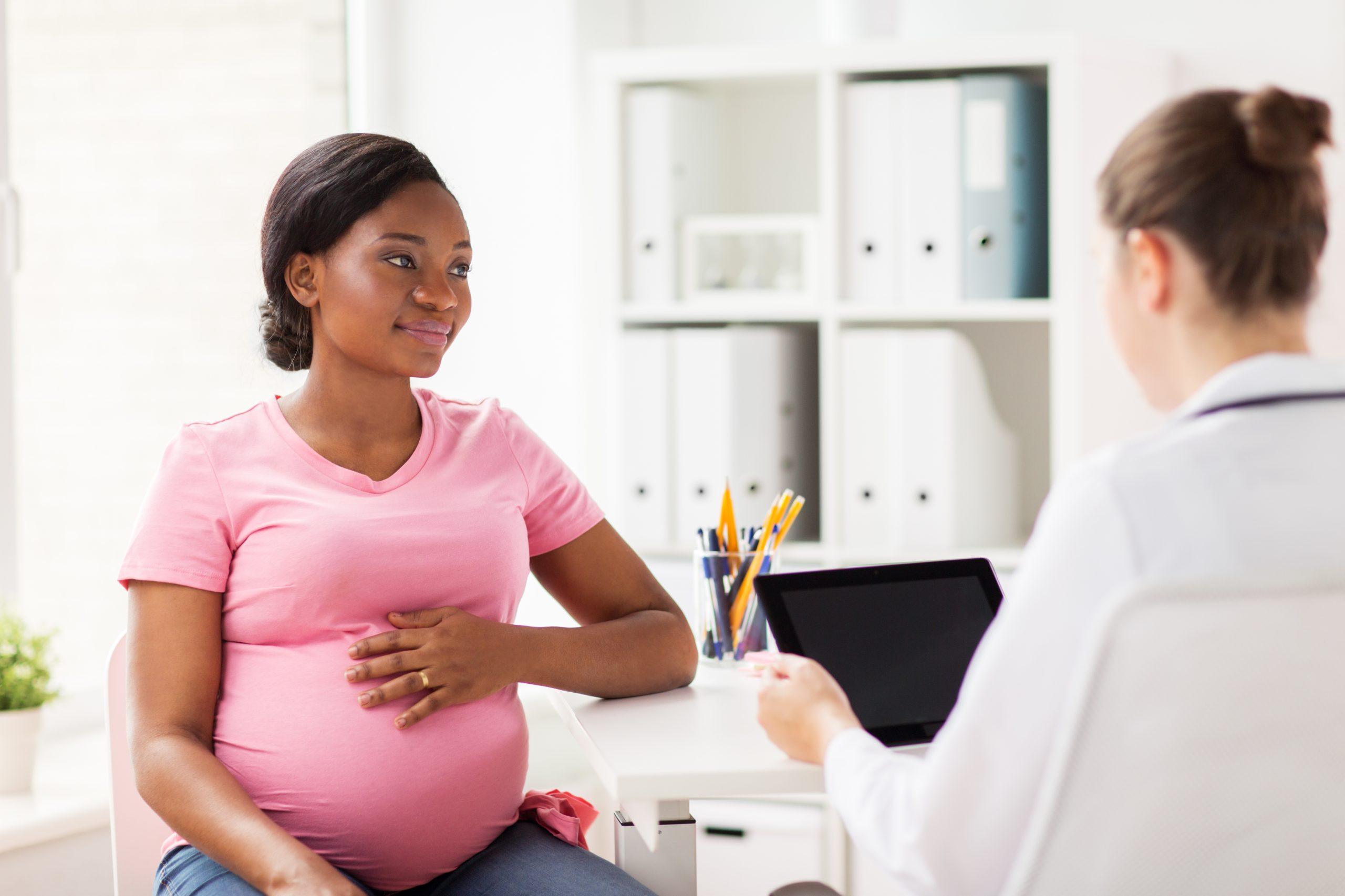 Sildenafil Citrate in Women With Infertility and a Thin Endometrium: A Review 2 doctor with tablet pc and pregnant woman at clinic