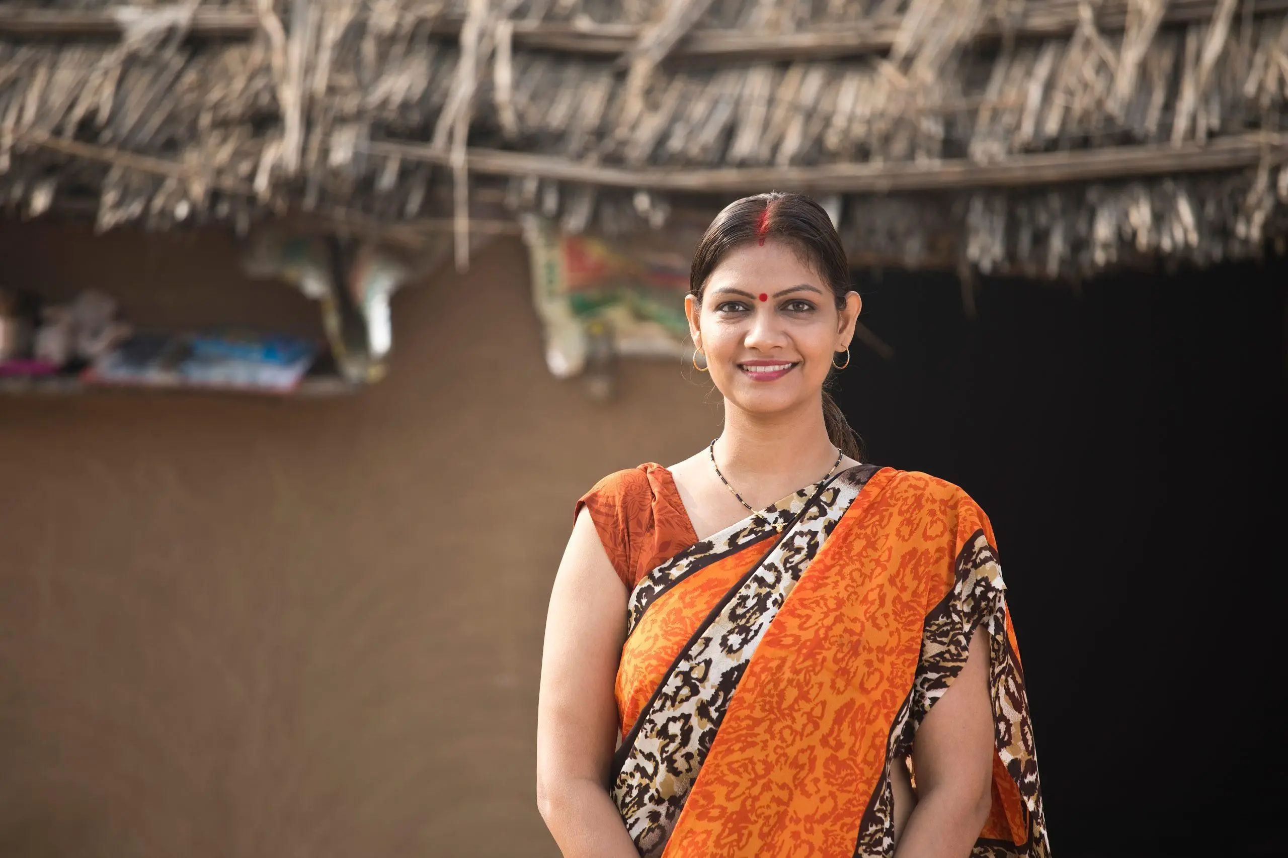 Portrait of beautiful Indian woman in sari at her house in village